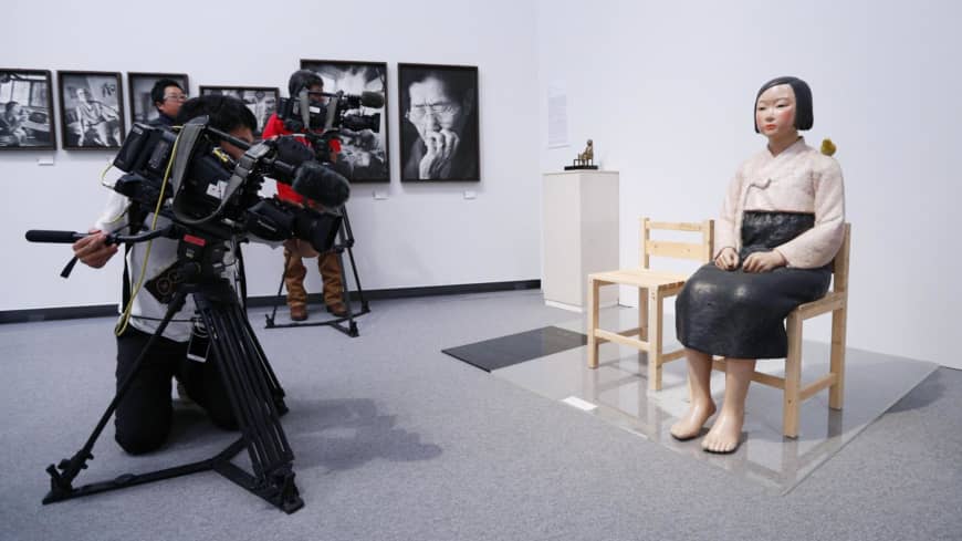A statue symbolizing "comfort women" at the Aichi Triennale art festival in Nagoya is seen on Aug. 3. After a two-month shutdown, the exhibit reopened Tuesday.