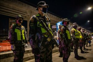 Policemen stand in formation at a quarantine checkpoint on April 2, 2020 in Marikina, Metro Manila, Philippines. Philippine President Rodrigo Duterte on Wednesday ordered law enforcement to "shoot" residents causing "trouble" during lockdown in the country.