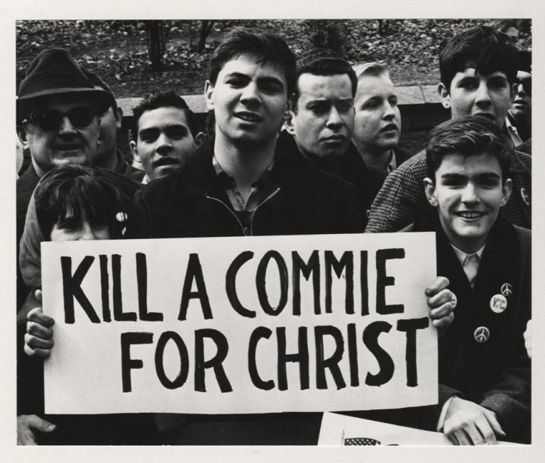 sign reading Kill A Commie For Christ