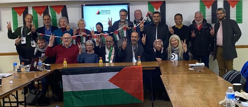 Gaza Freedom Flotilla organisation making peace sign.
