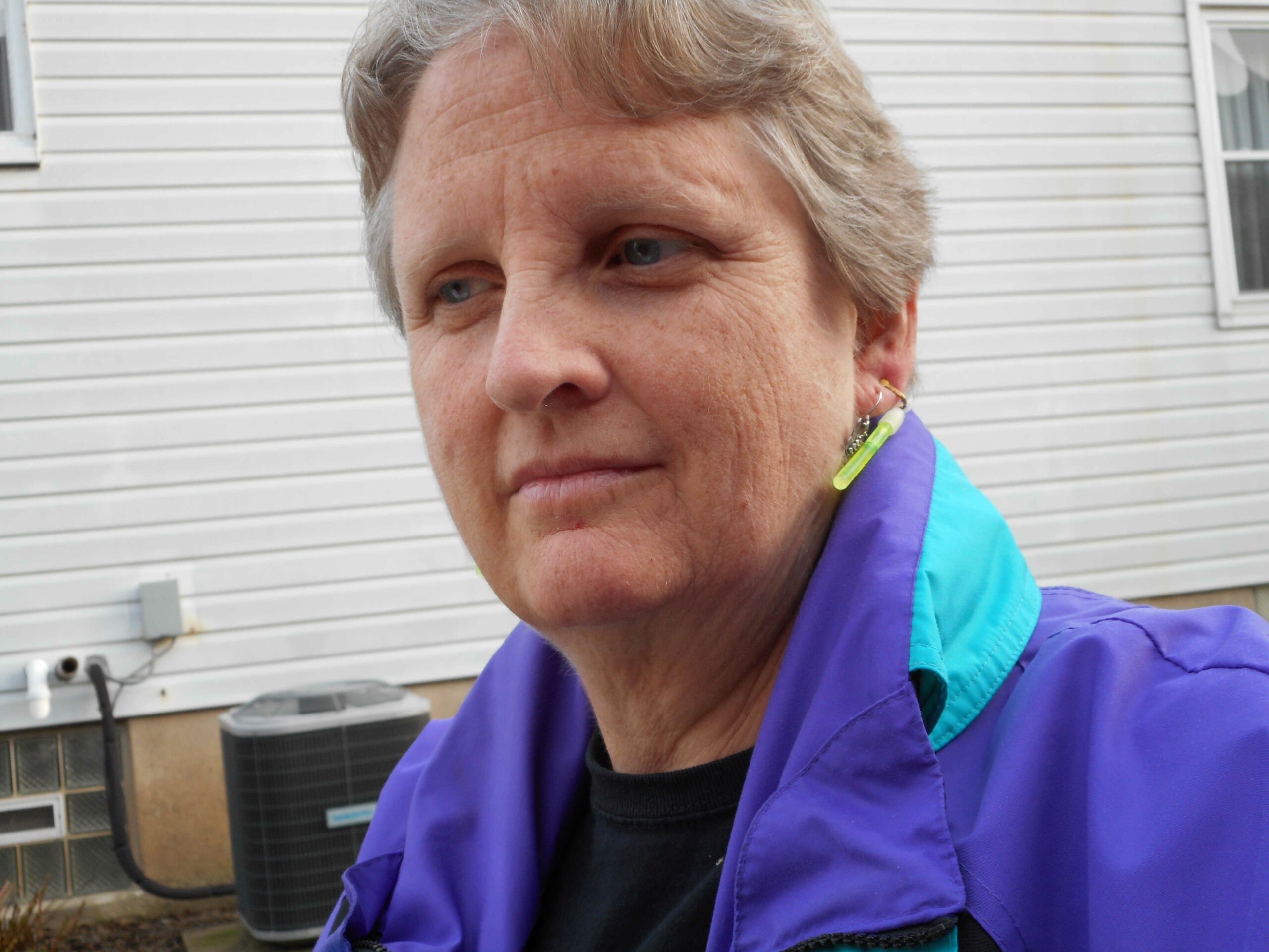 A headshot of Susan Smith wearing a purple winter coat