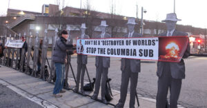 Nonviolent Activists Blockade General Dynamics Nuclear Sub Facility Using 27 Lifesize Images of Oppenheimer