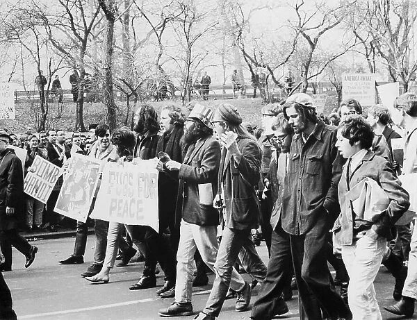 Vietnam War protest with many protestors. At center, Ed Sanders, Allen Ginsberg, Peter Orlovsky.