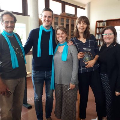 Asturias chapter members wearing blue peace scarves
